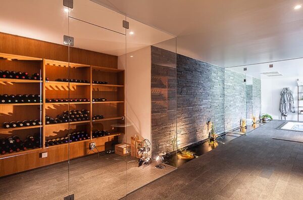 A wine lover's dream, this winde room doesn't hide the wine away in a musty cellar but puts it on display in a glass enclosed room.