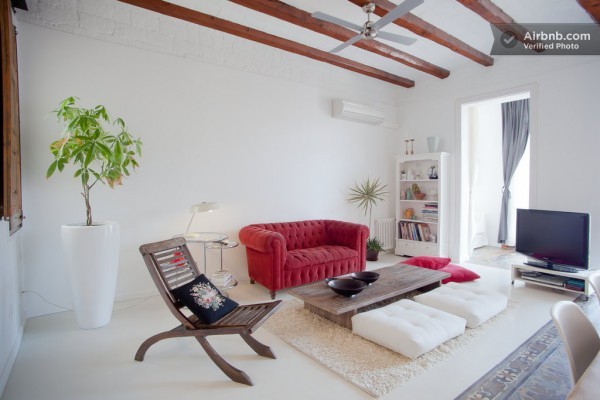 A vintage Chesterfield sofa provides a comfy spot to put up one's feet an relax.