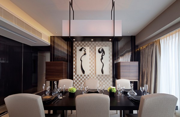 Asian influences give this handsome dining room an exotic repose with artisan crafted screen, lively artwork and dramatic lighting.
