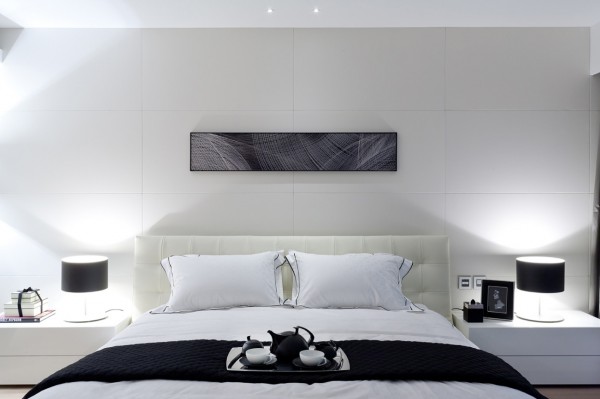 This bedroom is a testament to the welcoming simplicity of black and white.