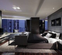 A common element in all of Leung's bedroom designs is atmospheric lighting. Here he illuminates the bed and media center display with recessed spotlights.