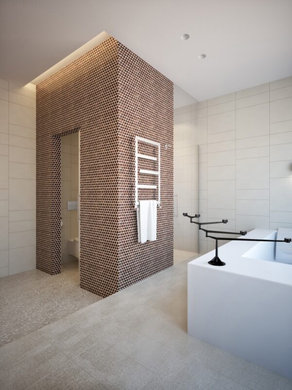 Thousands of tiny honeycomb tiles envelop the separate toliet and add texture and pattern in massive amounts to the otherwise neutral space.