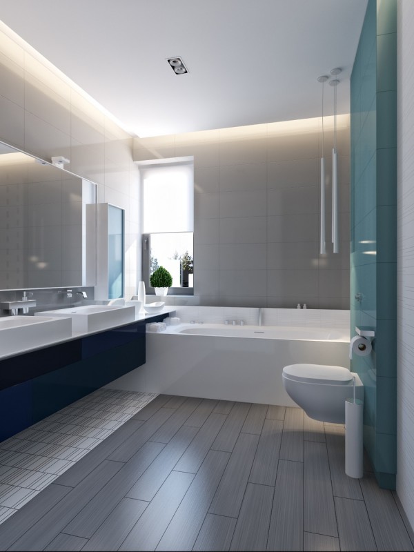 The mostly neutral house gets a burst of color from the vibrant blue secondary bathroom with light blue glass tiles behind the toliet and sleek modern cabinetry under the dual sink vanity.