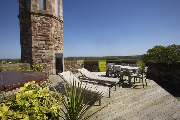 An inviting deck with modern lounge and dining furniture provides the perfect spot for entertaining and relaxing.