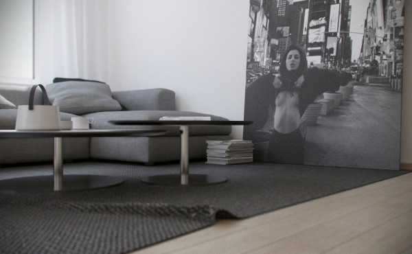 A bold-themed black and white photograph on a grand scale is the focal point of the apartment's living area.