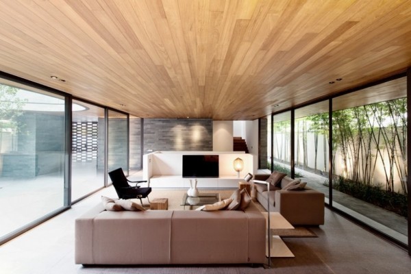 The light wood plank ceiling adds interest amongst the other neutral low-key elements of the main living room.