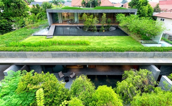 The lower levels sit beneath a lawn covered roof and top most level.