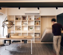 This modern office space quickly becomes a bedroom retreat with a Murphy bed hiding in the wall. It is a smart use of the space as even when the bed is set up, youâ€™re still able to function in the office without interference.