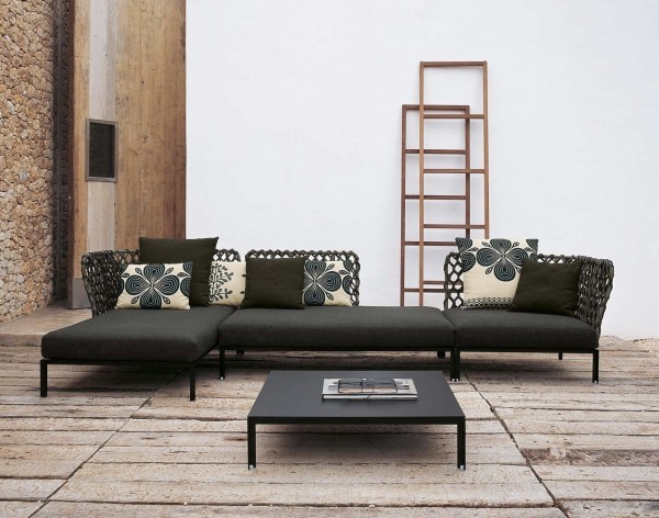 This woven-backed sofa is truly unique and is a conversation piece for any space. Relaxation is achieved with the use of accent pillows. The room itself has an earthy atmosphere and this piece brings modernity with a natural woven element.