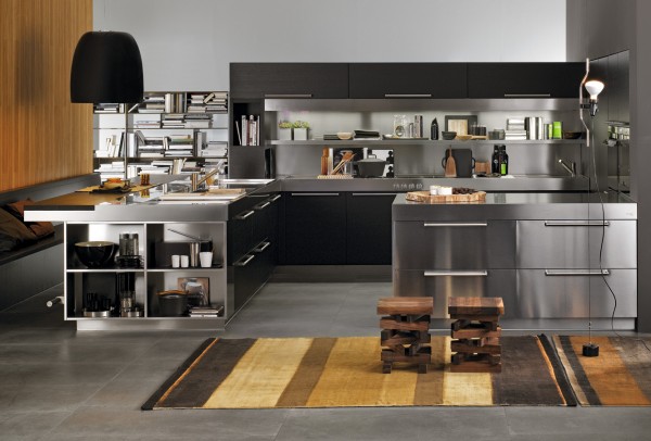 It's hard to tell at first whether this space is a kitchen or office. The cabinetry and furnishing are so modern with finishes in black and stainless steel.