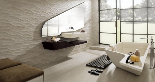 This is a truly unique bathroom with a floating sink and counter top and a freestanding square tub. The abstract mirror shape and textured walls give even more character.