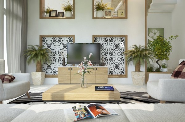 Your eye travels floor to ceiling in this living room design. Decorative boxes surrounded by wood molding encase two identical art pieces, and the same outlined boxes are repeated above them but except they are open and able to be used to shelf various decorative items. This also opens the rooms up. The many green plants also give life and a contrasting green accent color.
