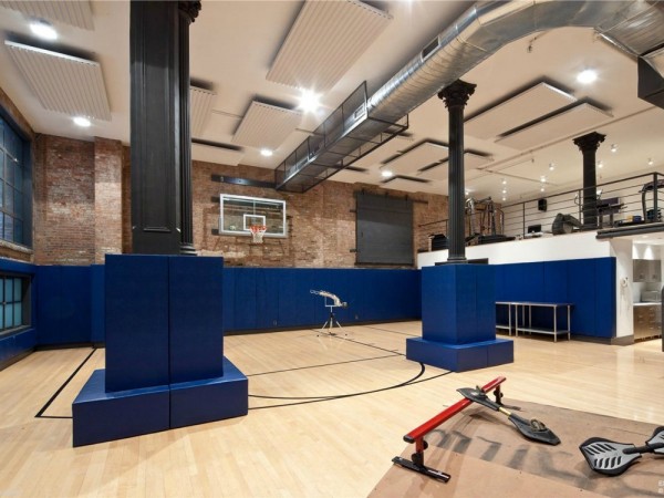 This lavish home also comes with a fitness center in the basement overlooking a basketball court.
