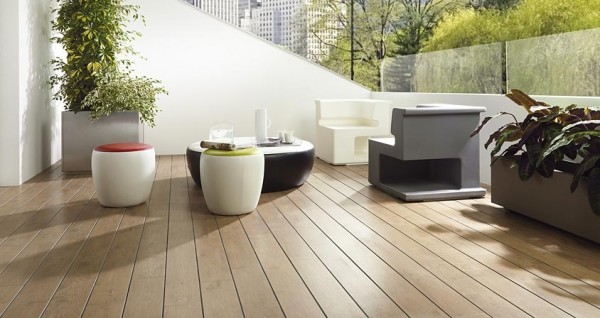 Contemporary designed furniture complete this outdoor patio with medium toned hardwood flooring.