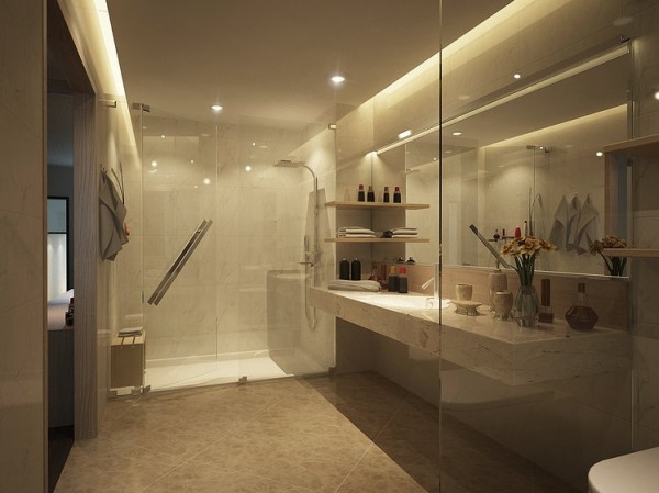 Although there isn't much privacy in this bathroom, there is style. A glass enclosed shower and toilet area really open up the room and make it appear very large.