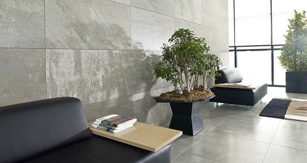 Natural stone wall tiles add a contemporary feel to this lobby space.