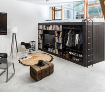 Though the cube offers a tremendous amount of storage space, its size does not overwhelm the Bern apartment. Instead, it acts as a focal point for visitors. Tucking it away in the corner also means it does not consume valuable floor space.
