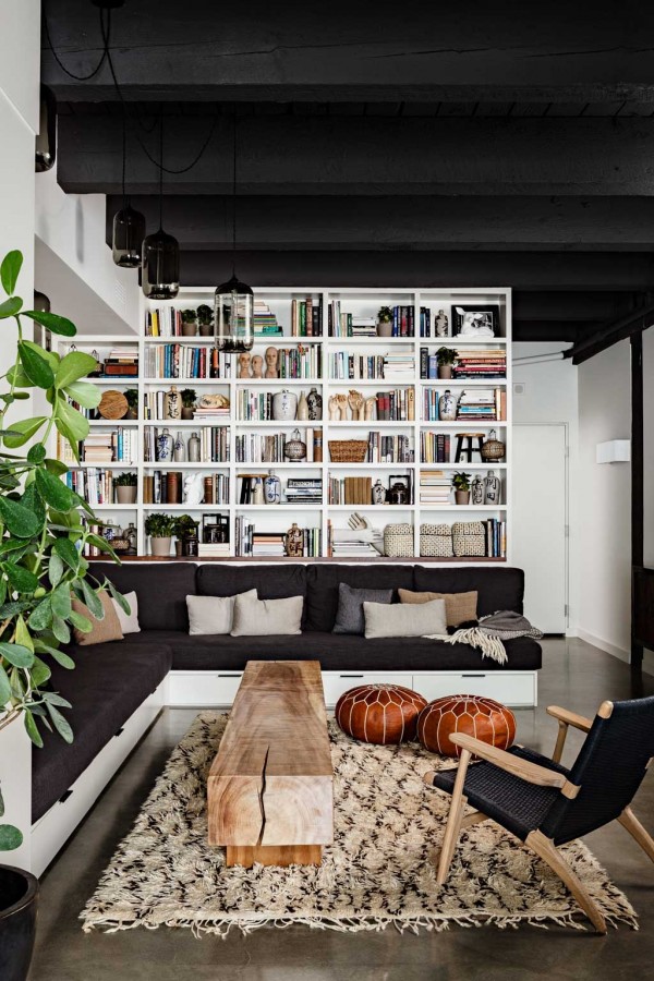 Just because you have access to a lot of shelving does not mean that every inch needs to be full of books. These shelves are instead carefully curated with books, magazine, and various knick-knacks for display. The result is both storage and décor.