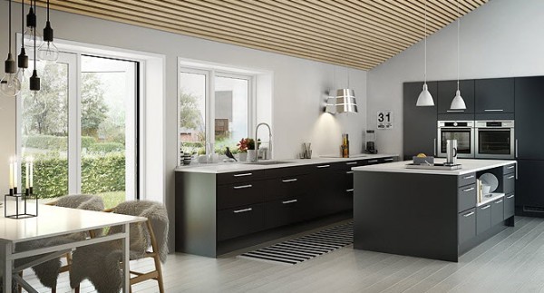 By using black and white as the color palette for this modern kitchen, the designers give it an instantly timeless feeling. An expansive island offers more surface area while appliances built into the wall keep the temperature reasonable, regardless of that old adage about heat and kitchens.