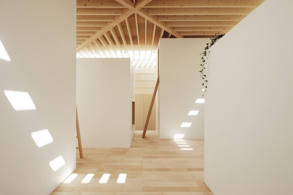 The architects worked to create a space that celebrates both light and shadow. The way that the slats in the roof allow and block sunlight and different angles turns the light itself into an artistic show inside the home.