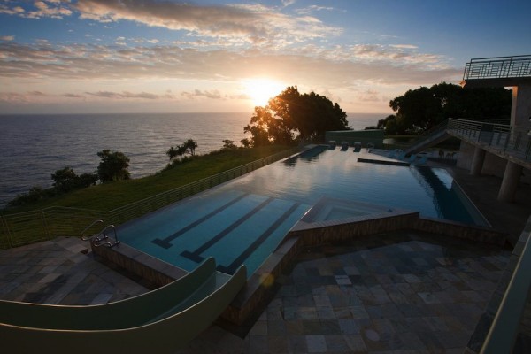 An Olympic-sized pool has three lanes as well as starting blocks, but the aquatic facilities do not stop there. The house also has a deep diving pool with a springboard and a shallow kiddie pool for youngsters to enjoy. Of course, anyone who would prefer saltwater is only a few steep steps from the ocean.