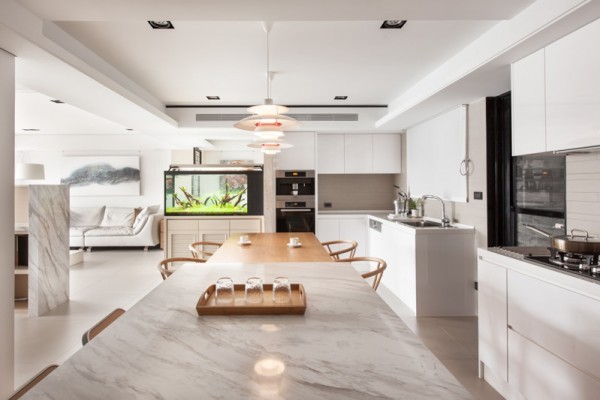 While the kitchen is typically a place that bursts of color find their home, this one has been kept a gleaming white from cabinetry to countertop.