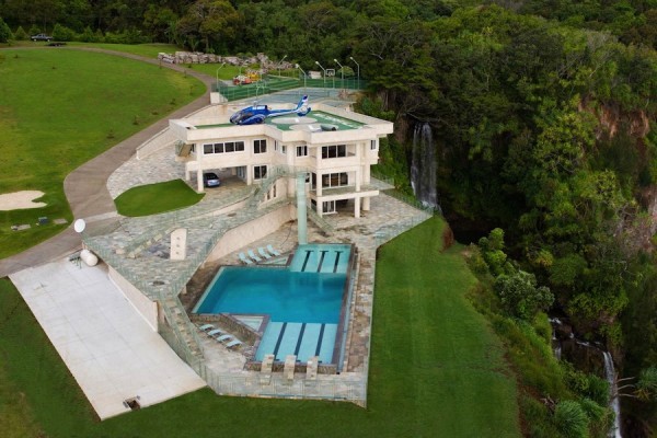 Photos cannot truly do justice to this massive, beautiful concrete home. From every angle, it is luxury and Hawaiian elegance.