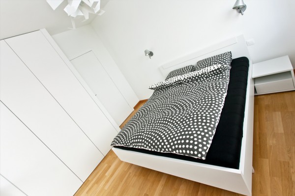 The bedroom is simple and small, but plenty of built in storage space means it can stay neat at all times.