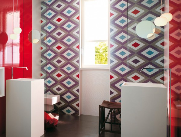 This bathroom makes a statement and then some! Geometric patterns adorn large wall tiles, creating a splash of statement color in a room that quite often lacks oomph! The facing cuboid basins add to the off-beat quirky image of the room.