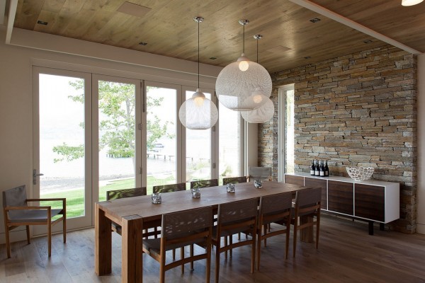 The ceiling finishes echo the seamless flooring in French oak planking, which also brings a taste of the outdoors inside. The pre-distressed material is also a durable surface, and provides the most dominant feature throughout the home. To soften the floors and bring a little extra comfort and warmth underfoot, deep taupe rugs have been added, which also help define areas.