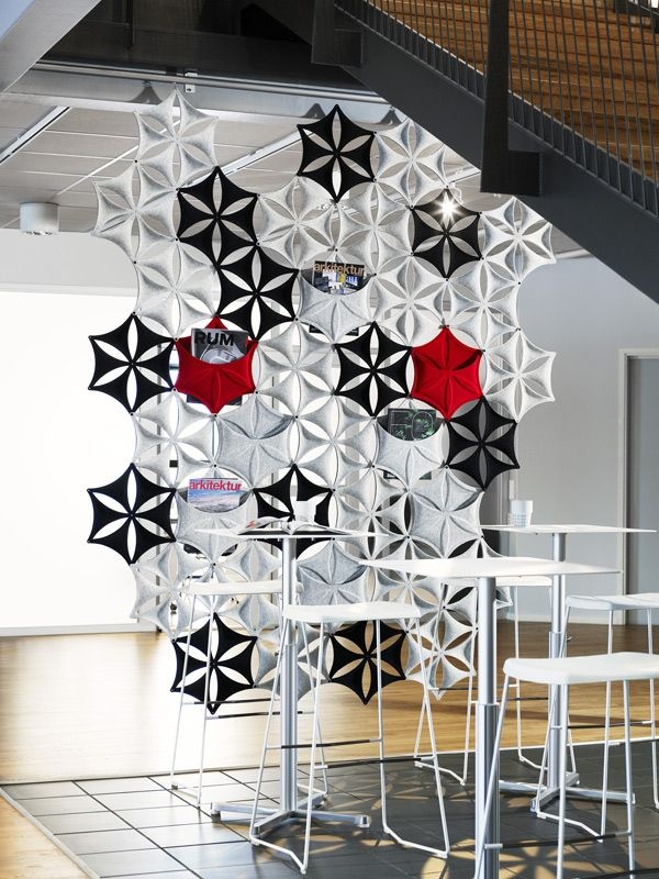 Part art installation, part partition, this bright snowflake design also has pockets for reading material or other décor.