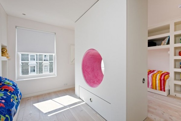No one said a room divider had to be boring. This pink plush tunnel makes it a bit more fun for kids to share a room.
