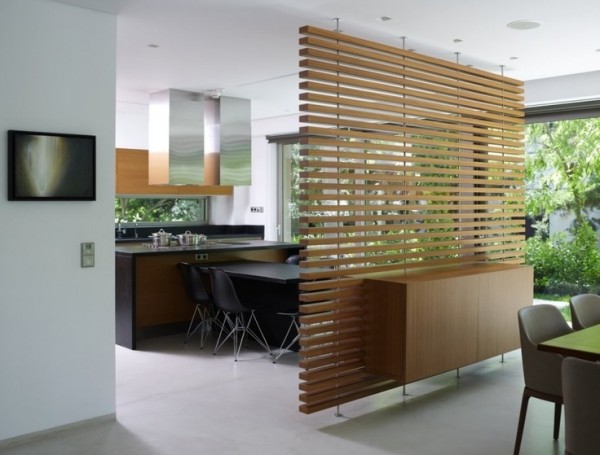 Another easily installed piece, these wooden slats take inspiration from Japanese design and perfectly separate the dining area from the breakfast nook in this simply elegant home.