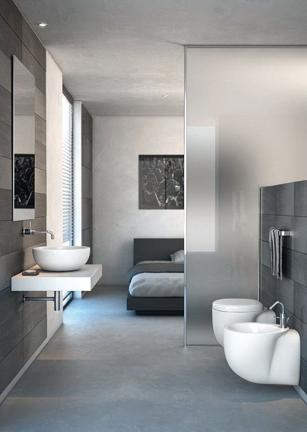 Taking the partition to the next level, this particular en suite does not even have a whole wall separating the bedroom from the bath, instead using frosted glass.
