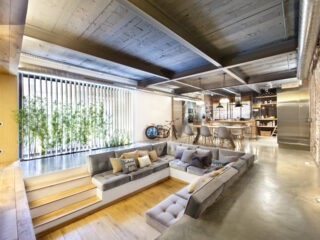 Industrial Home with Interior Planting and Transparent Walls