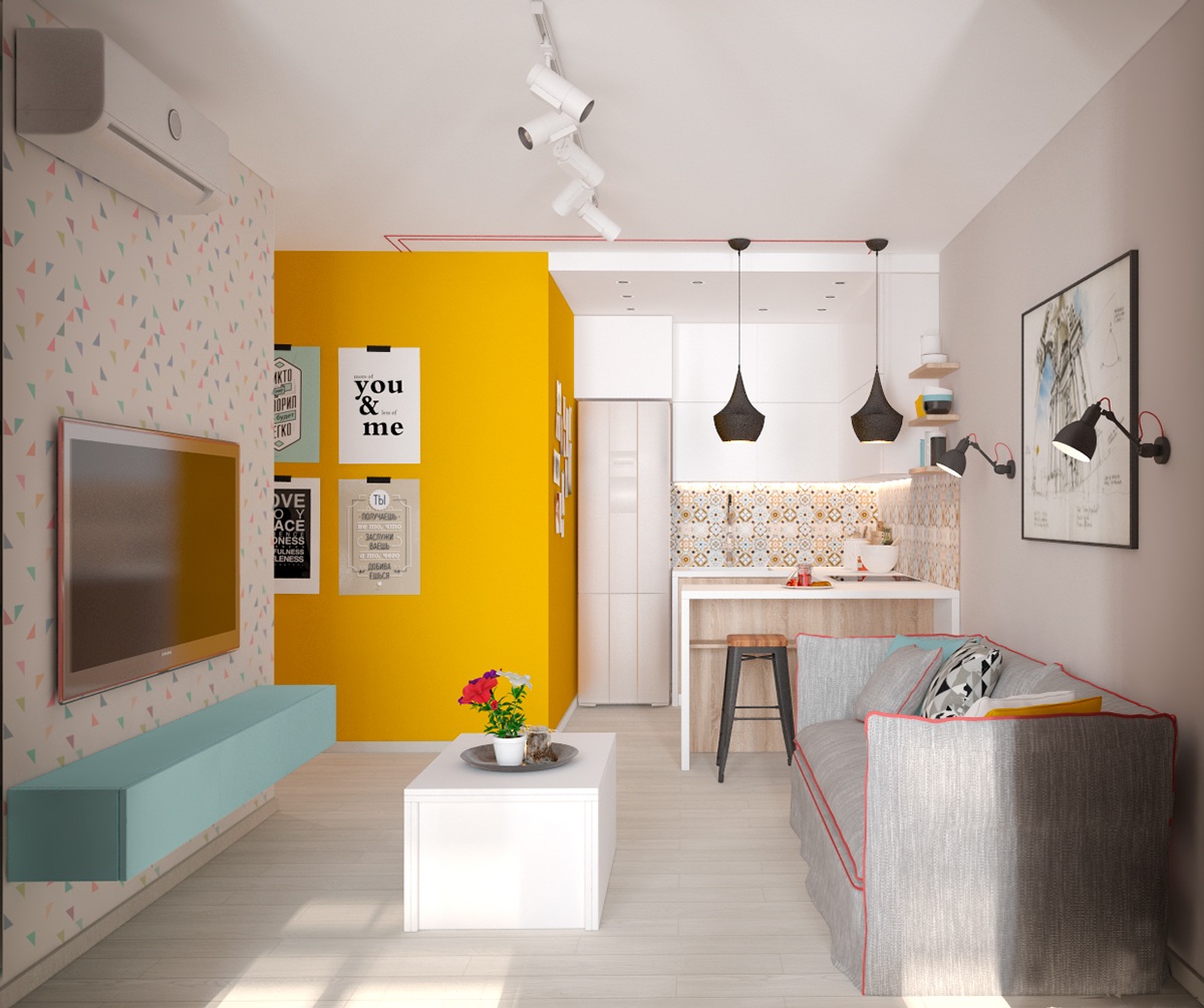 This small apartment in Kiev is a perfect starter. Opening the door on a bold mustard wall, confetti wallpaper greets the eye on pale teak floors. A focal point of interest in two black hanging lights offers promises in the larger space beyond.