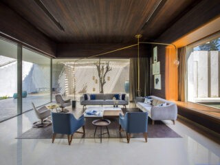 Cross Shaped Modern Home In Peaceful Landscaped Gardens