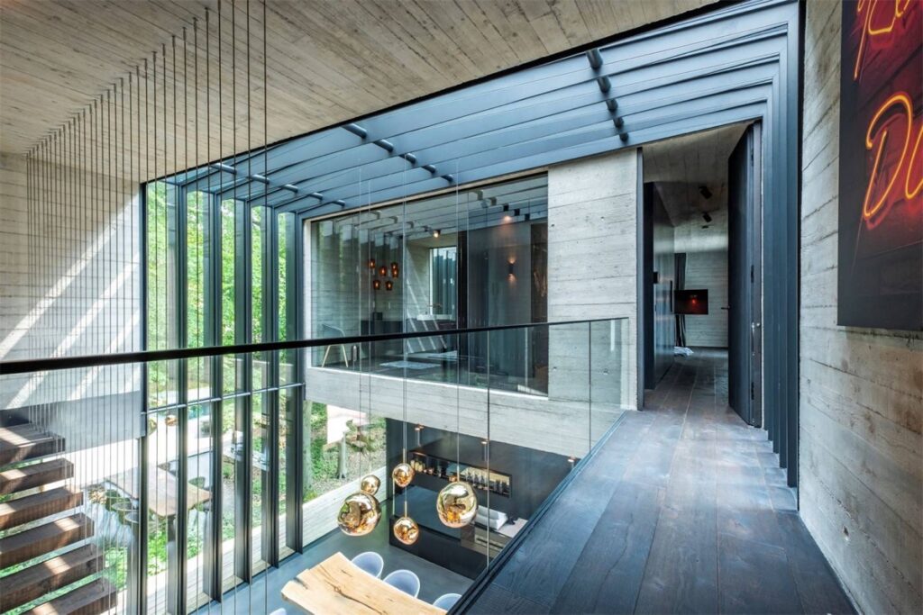 luxury modern home with floor to ceiling windows and skylights ...