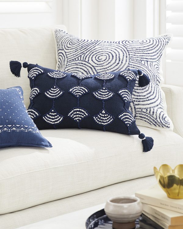 https://www.home-designing.com/wp-content/uploads/2020/09/Blue-Embroidered-Decorative-Pillow-Coastal-Style-Dark-Blue-and-White-Linen-and-Raffia-with-Tassles-600x750.jpg