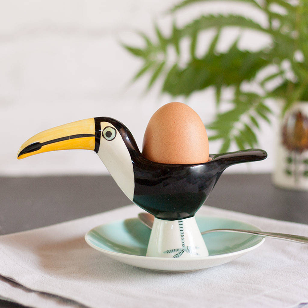 https://www.home-designing.com/wp-content/uploads/2021/05/toucan-egg-cup-handmade-ceramic-tableware-unique-gift-ideas-accessories-for-breakfast-table-tropical-kitchen-decor.jpg