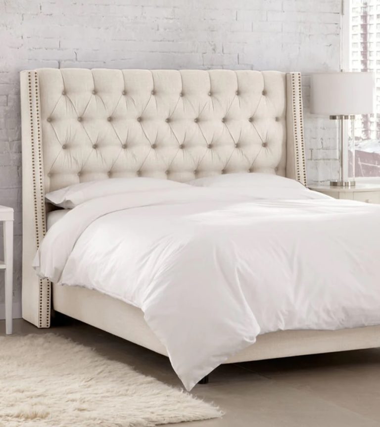 classic tufted wingback bed with beige upholstery off white and diamond