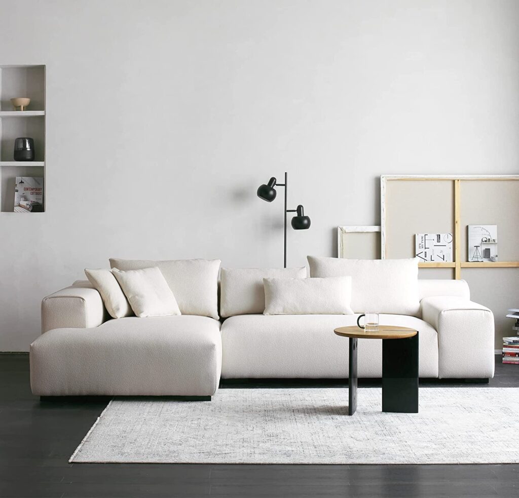 oversized white sectional sofa with pillowy overstuffed cushions and
