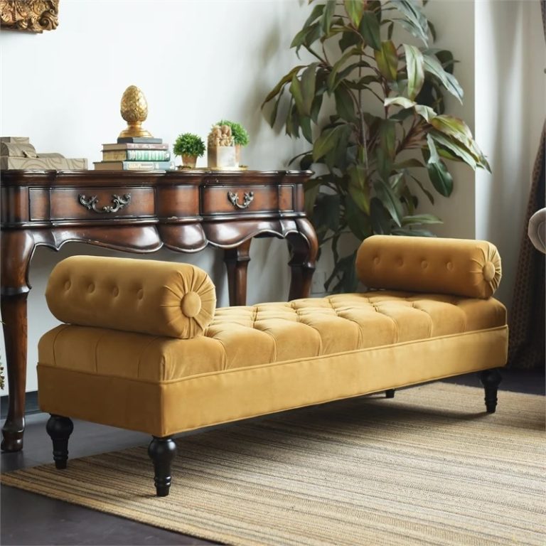 mustard yellow tufted bench seat with round cylindrical armrests