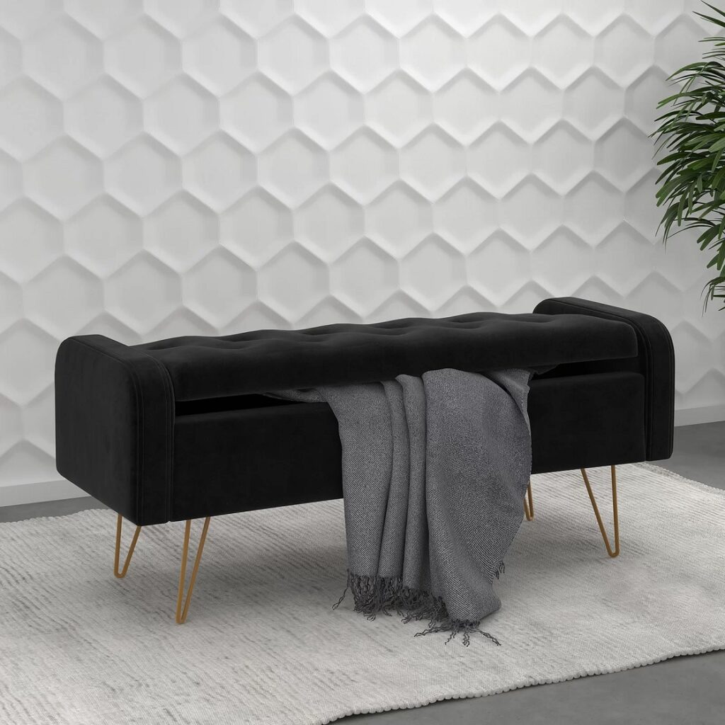 rich black tufted storage bench with rounded edges and deep button