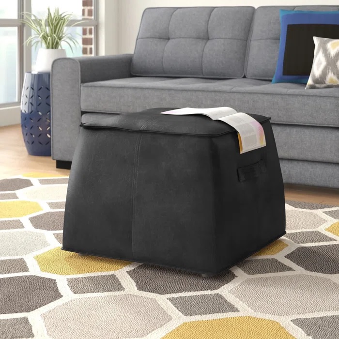 tapered black leather ottoman with soft surface and handles on each side easy to move large ottomans for living room comfortable multipurpose furniture stylish modern
