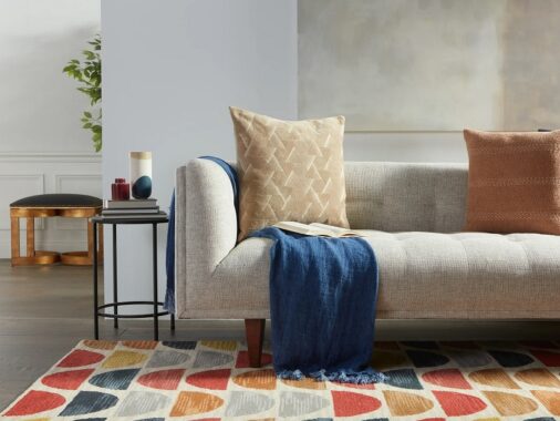 colorful mid century modern rug with half circle pattern rhythmic decor inspiration bright vibrant red orange yellow blue grey colorway fun retro living room rugs