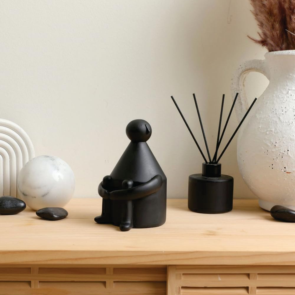 contemplative ceramic figurine 4