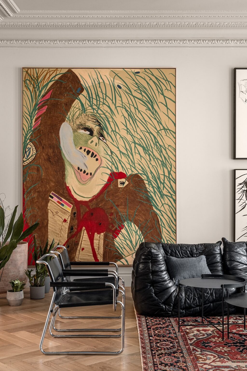 black leather sofa with black cesca chairs