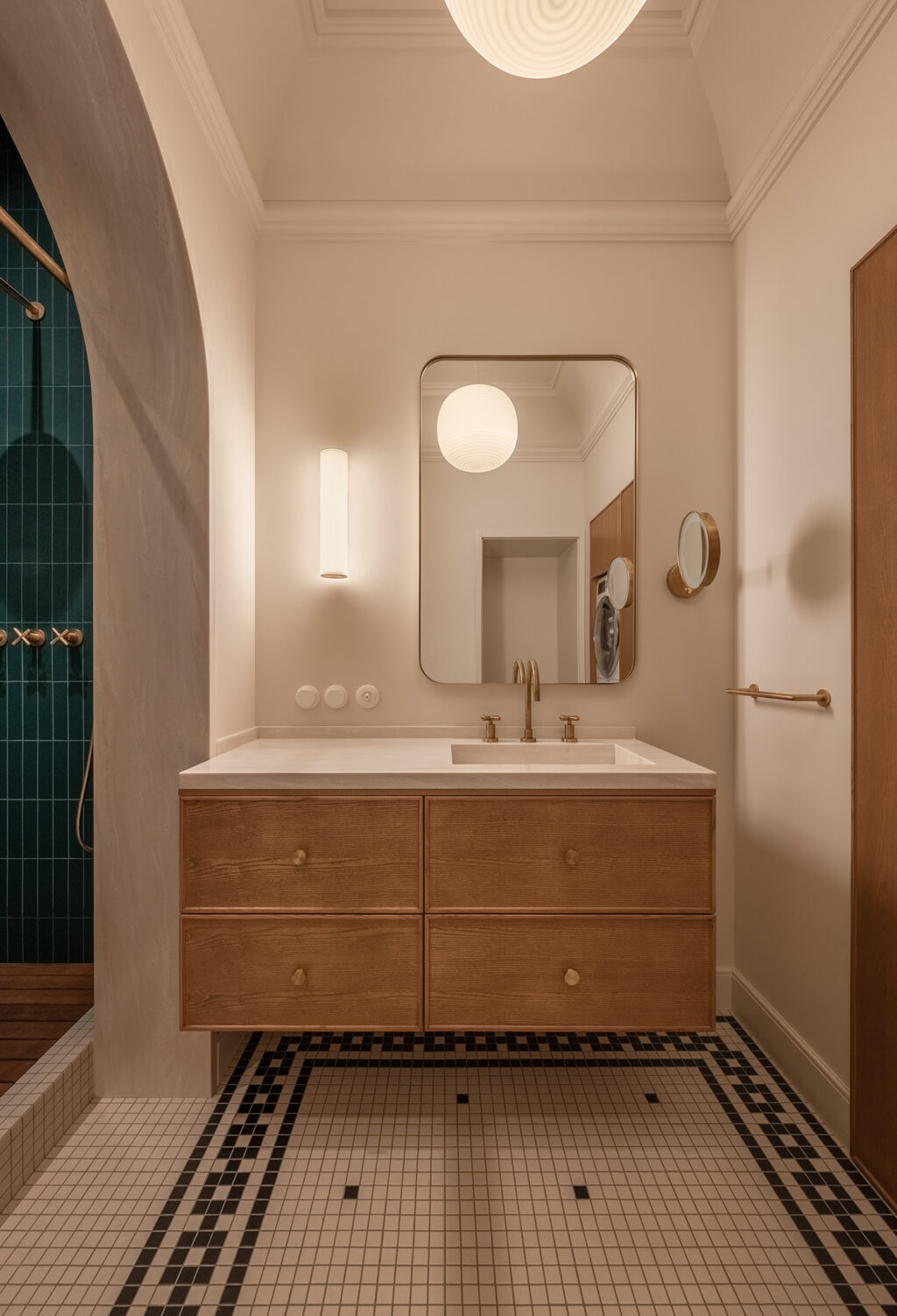 wooden vanity with gold faucet